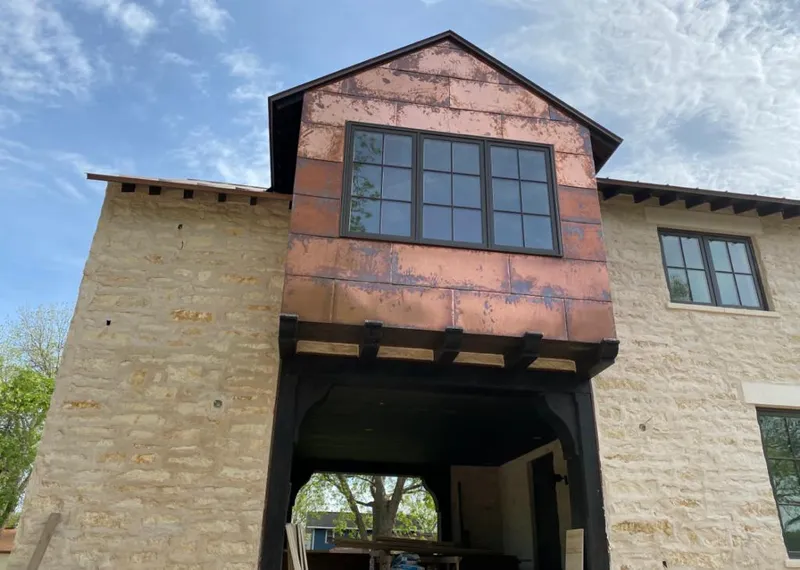 Copper metal panel facade on a stone building for Metal Roof Coating in Putnam